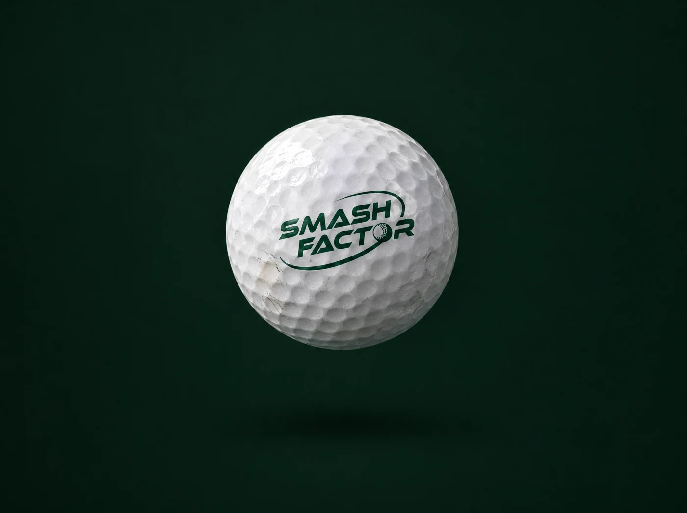 A white golf ball carrying the Smash Factor logo